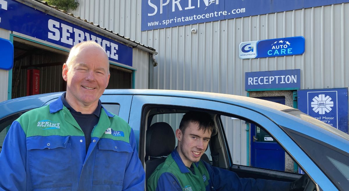 Garage Owner , Pat McCrea with SERC Apprentice, Daniel Scullion at the wheel of his car